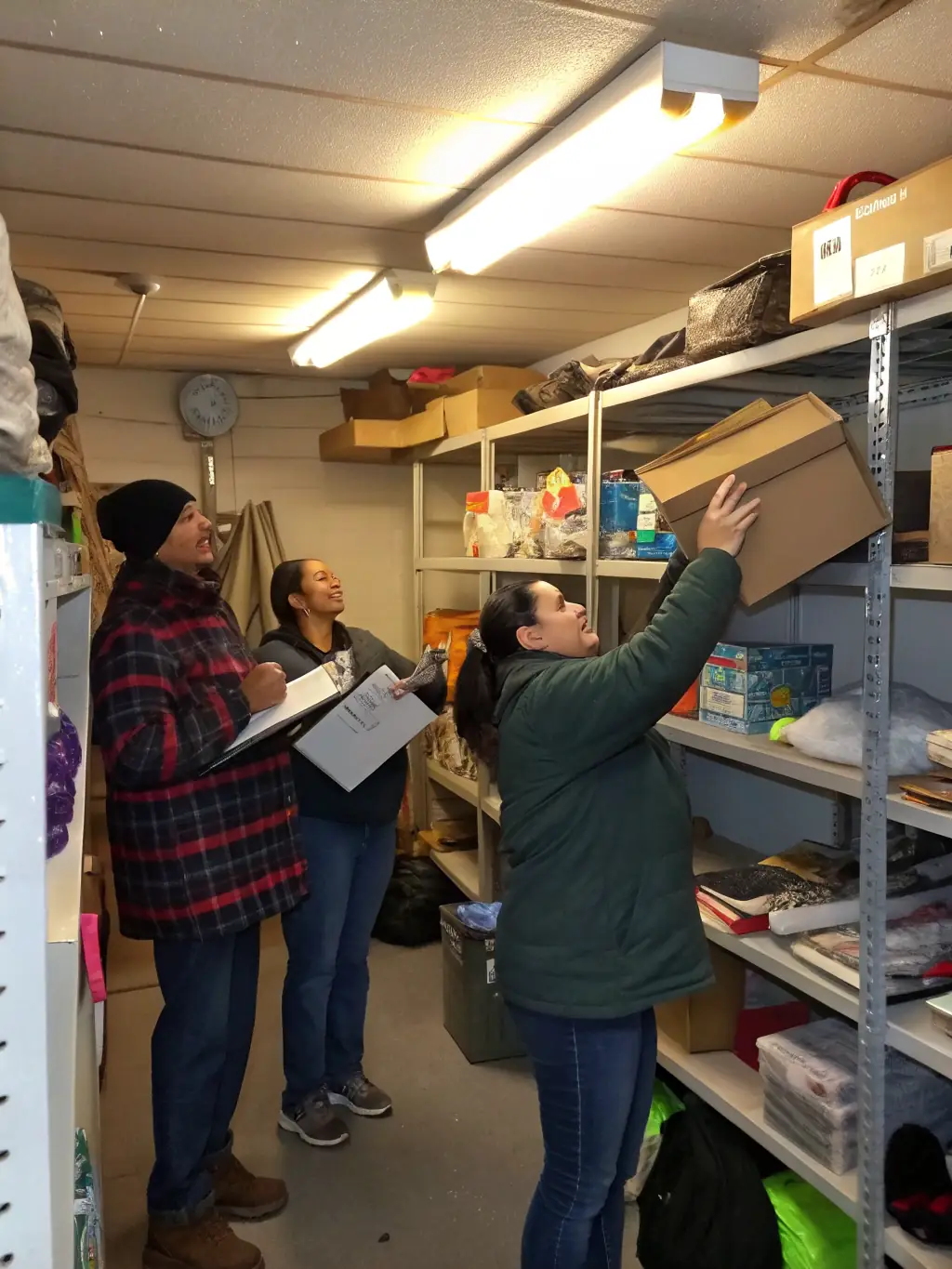 A team efficiently clearing out a cluttered garage and organizing items for disposal or donation, streamlining the cleanout process.